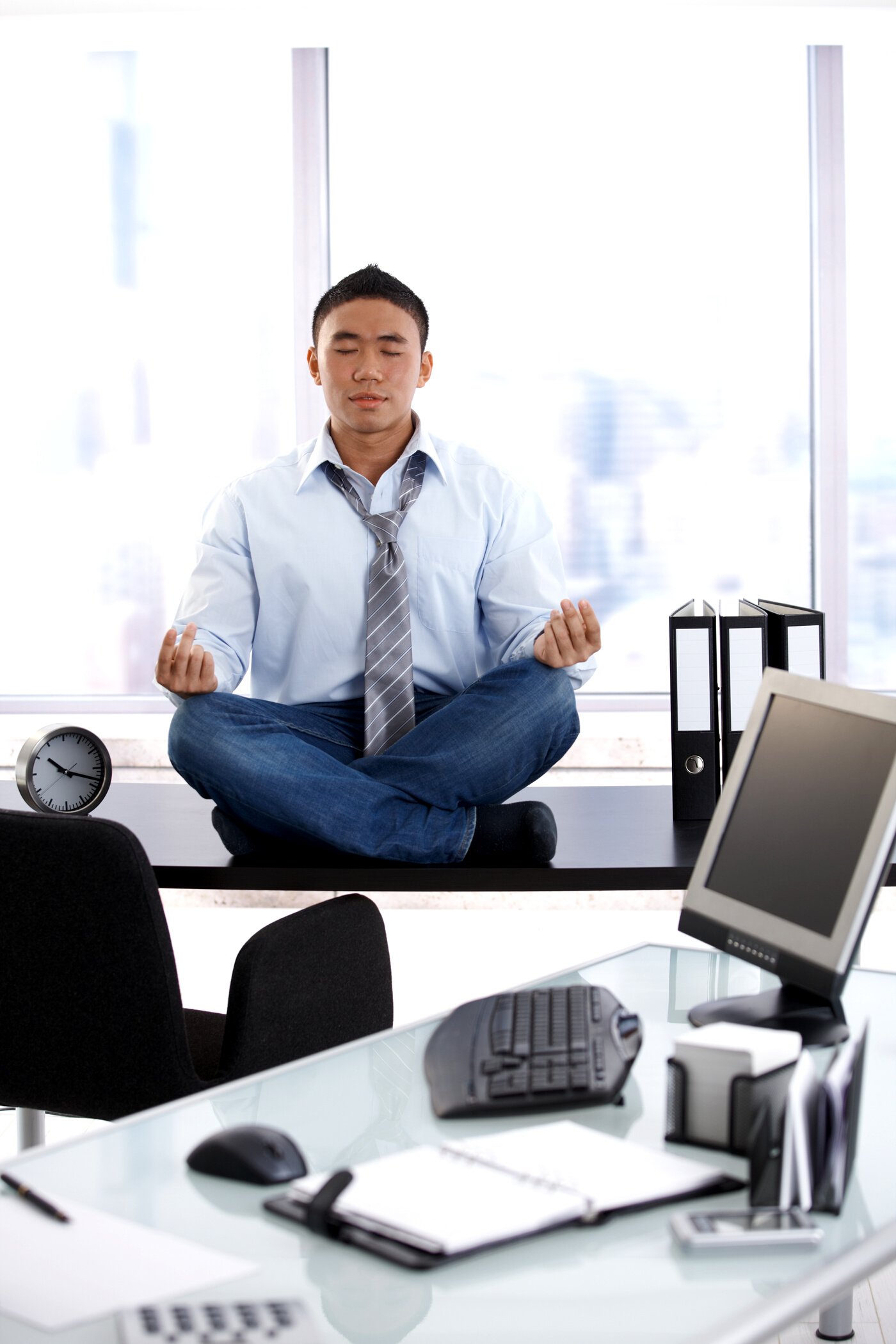 Businessman Meditating in the Office